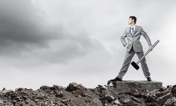 Businessman with hammer — Stock Photo, Image