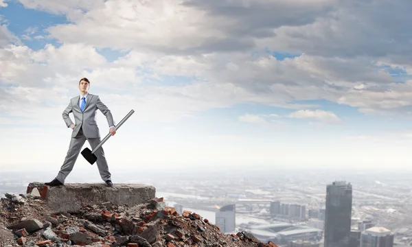 Businessman with hammer — Stock Photo, Image