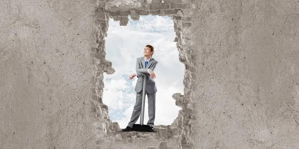 Businessman with big hammer in hands — Stock Photo, Image