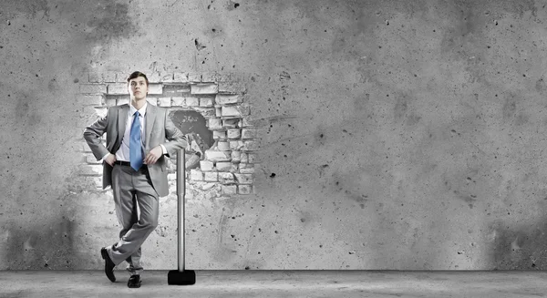 Businessman with big hammer in hands — Stock Photo, Image