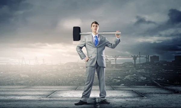 Businessman with hammer — Stock Photo, Image