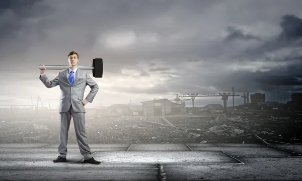 Businessman with hammer — Stock Photo, Image