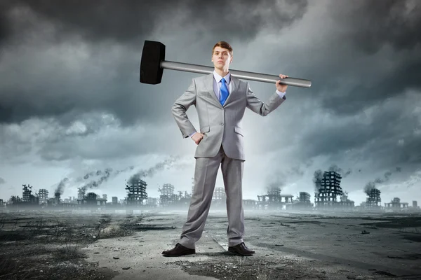 Businessman with hammer — Stock Photo, Image