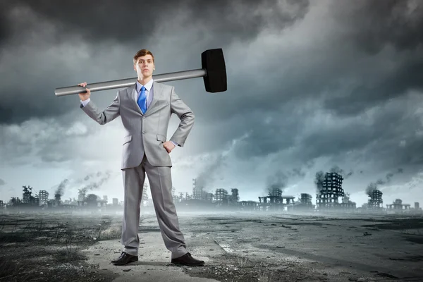 Businessman with hammer — Stock Photo, Image