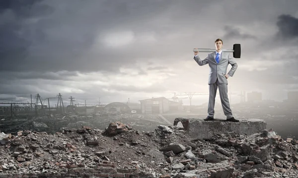 Businessman with hammer — Stock Photo, Image