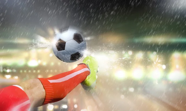 Footballer foot kicking ball — Stock Photo, Image