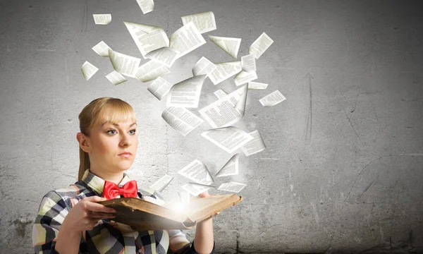 Woman holding book in hands — Stock Photo, Image