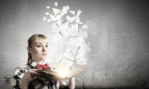 Woman holding book in hands — Stock Photo, Image