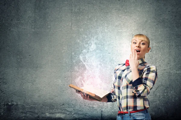 Woman holding book in hands — Stock Photo, Image