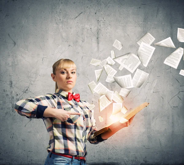 Woman holding book in hands — Stock Photo, Image