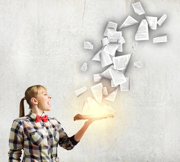 Woman holding book in hands — Stock Photo, Image