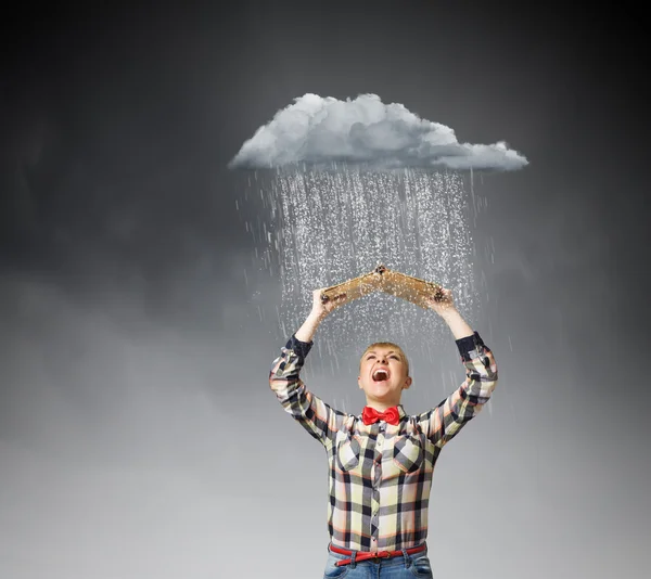 Woman holding book above head — Stock Photo, Image