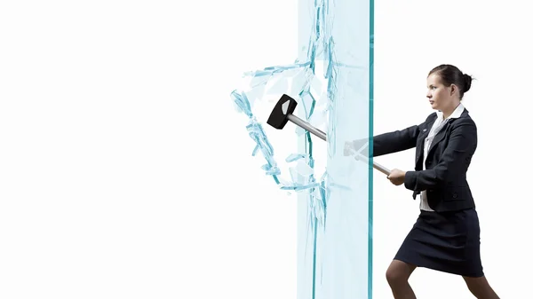 Businesswoman breaking glass — Stock Photo, Image