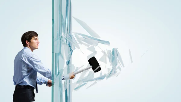 Businessman breaking glass — Stock Photo, Image
