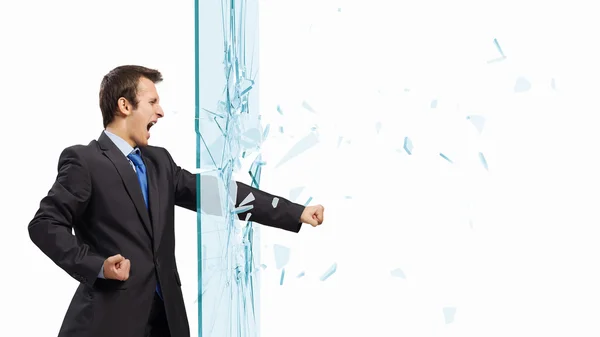 Businessman breaking glass — Stock Photo, Image