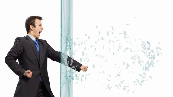 Businessman breaking glass — Stock Photo, Image