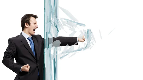 Businessman breaking glass — Stock Photo, Image