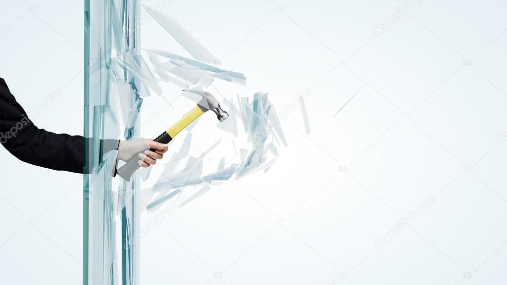 Hand breaking glass with hammer Stock Photo by ©SergeyNivens 52983495
