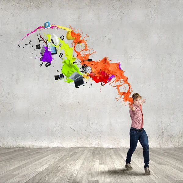 Man throwing paint splashes — Stock Photo, Image