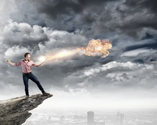 Man throwing fire ball — Stock Photo, Image