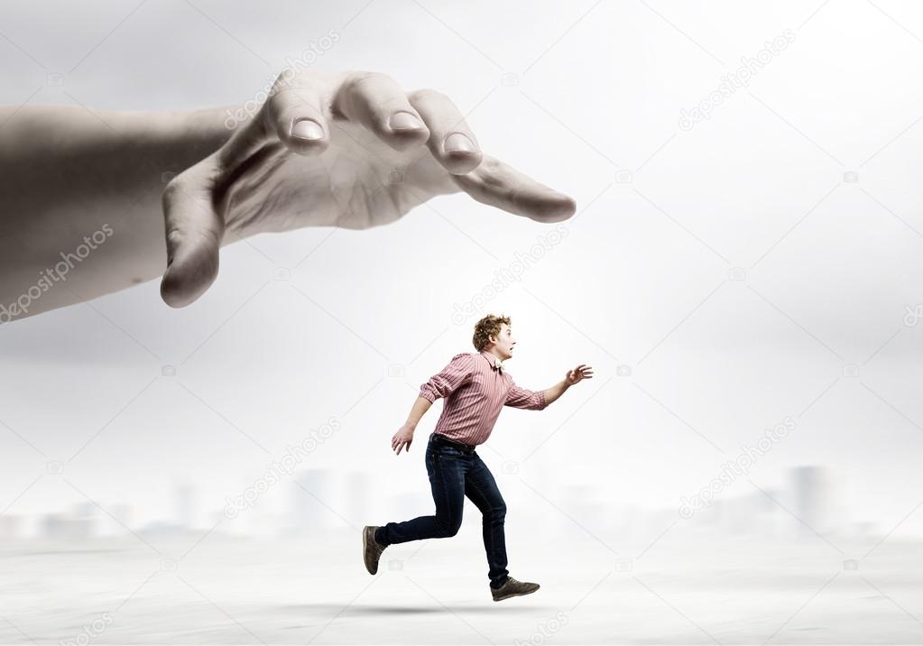 Man running from hand