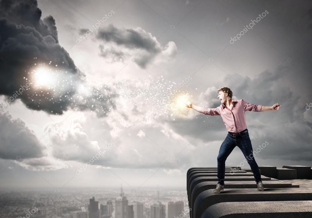 Man throwing star dust Stock Photo by ©SergeyNivens 53046651