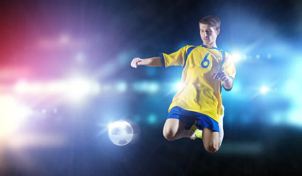 Football player taking ball — Stock Photo, Image