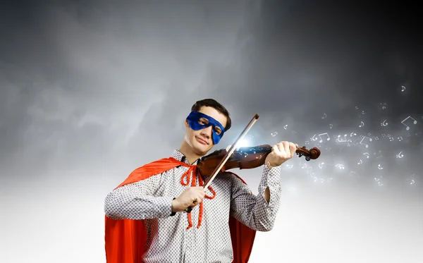 Superman playing violin — Stock Photo, Image