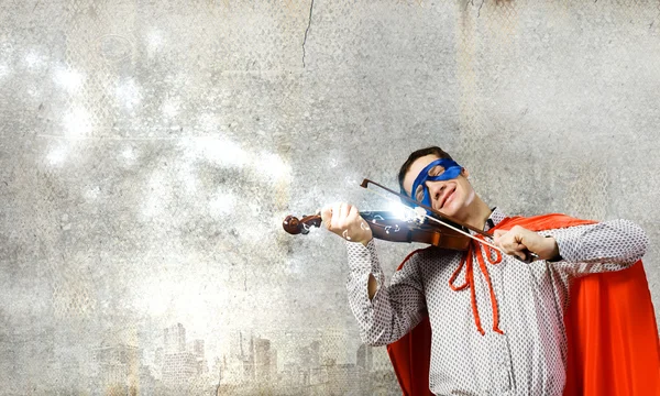 Superman playing violin — Stock Photo, Image