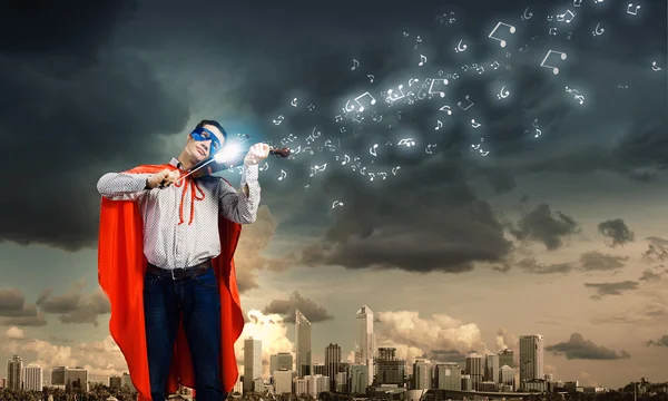 Superman playing violin — Stock Photo, Image