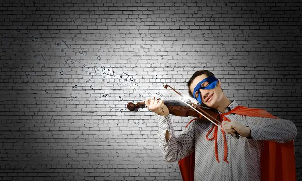 Superman playing violin — Stock Photo, Image