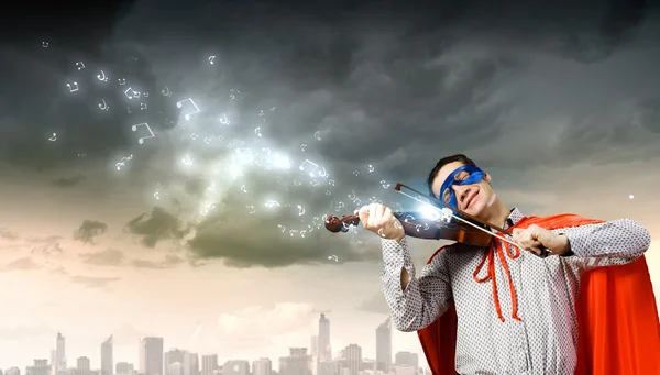 Superman playing violin — Stock Photo, Image