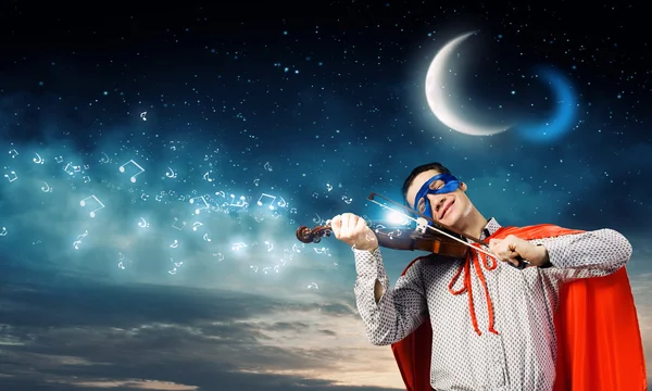 Superman playing violin — Stock Photo, Image