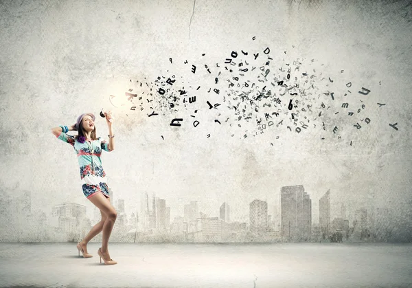 Woman speaking in megaphone — Stock Photo, Image