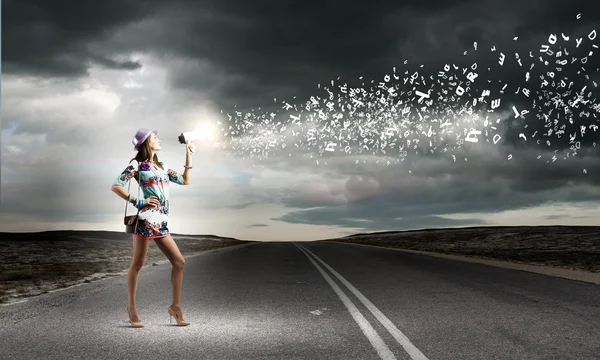 Woman speaking in megaphone — Stock Photo, Image