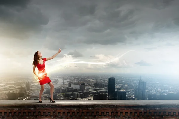 Woman imitating playing guitar — Stock Photo, Image