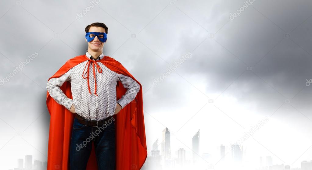 Man wearing superman mask and cape