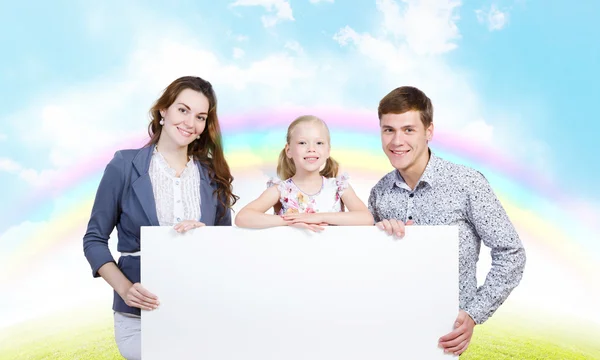 Familia feliz sosteniendo bandera blanca en blanco — Foto de Stock