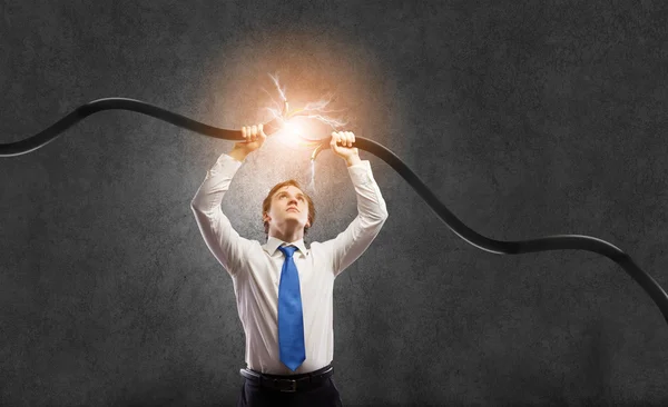 Man tearing cable — Stock Photo, Image