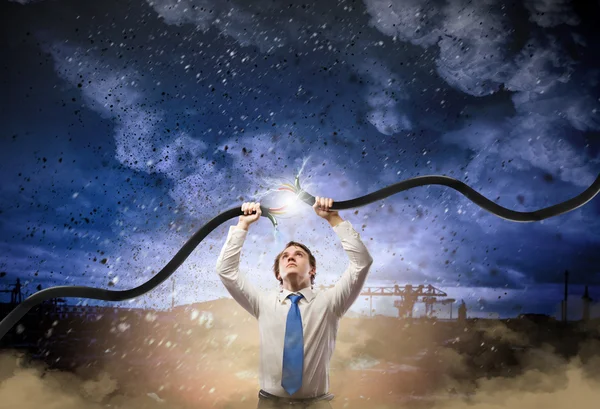 Man tearing cable — Stock Photo, Image