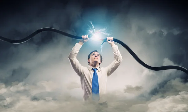 Man tearing cable — Stock Photo, Image