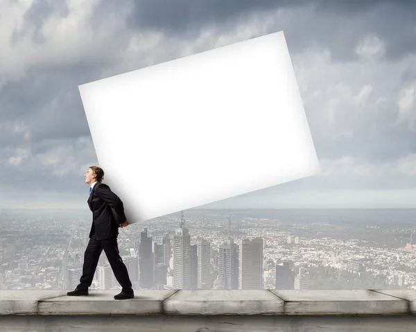 Man carrying banner — Stock Photo, Image