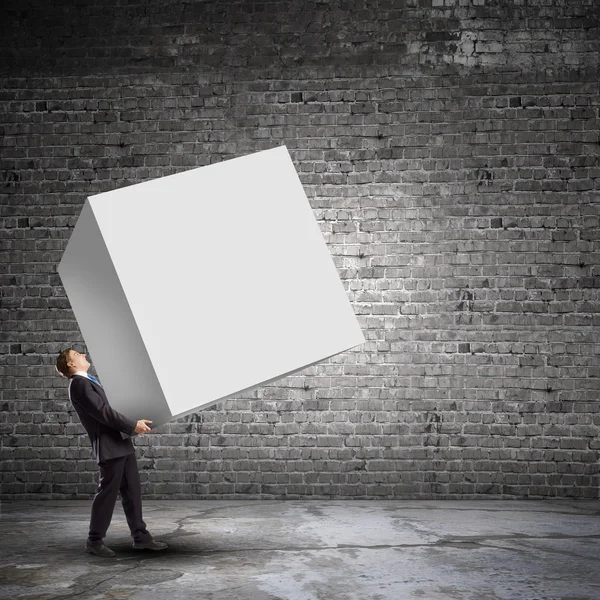 Businessman carrying cube — Stock Photo, Image