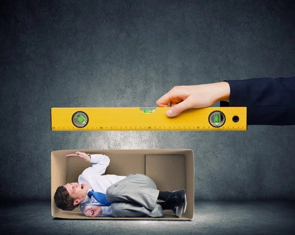 Businessman in carton box — Stock Photo, Image