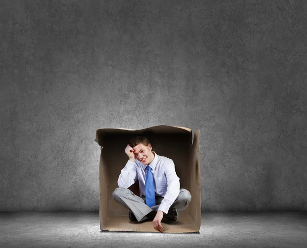 Hombre en caja — Foto de Stock