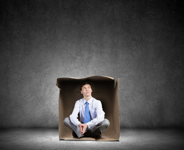 Hombre en caja — Foto de Stock