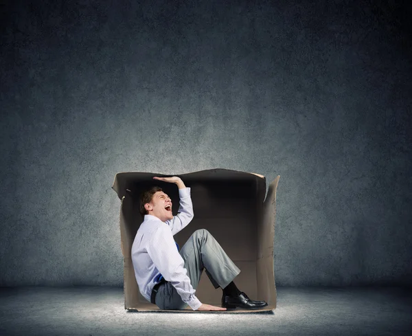 Hombre en caja — Foto de Stock