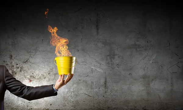 Businessman with bucket — Stock Photo, Image