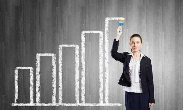 Woman with paint brush — Stock Photo, Image