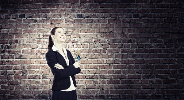 Woman with paint brush — Stock Photo, Image